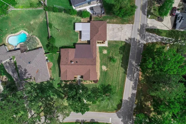 an aerial view of a house with a garden