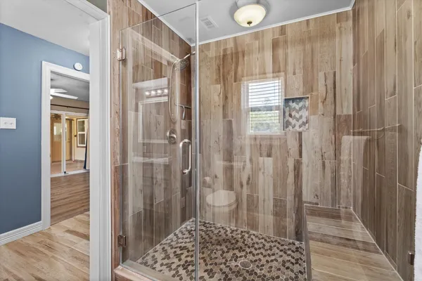 a bathroom with a shower and a sink