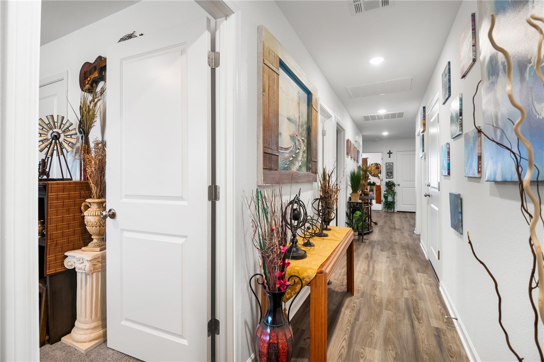 3623 East Andrea Drive Kingman, AZ 86409 - Photo 6 of 40 The hallway features light-colored walls, wood-style flooring, and recessed lighting