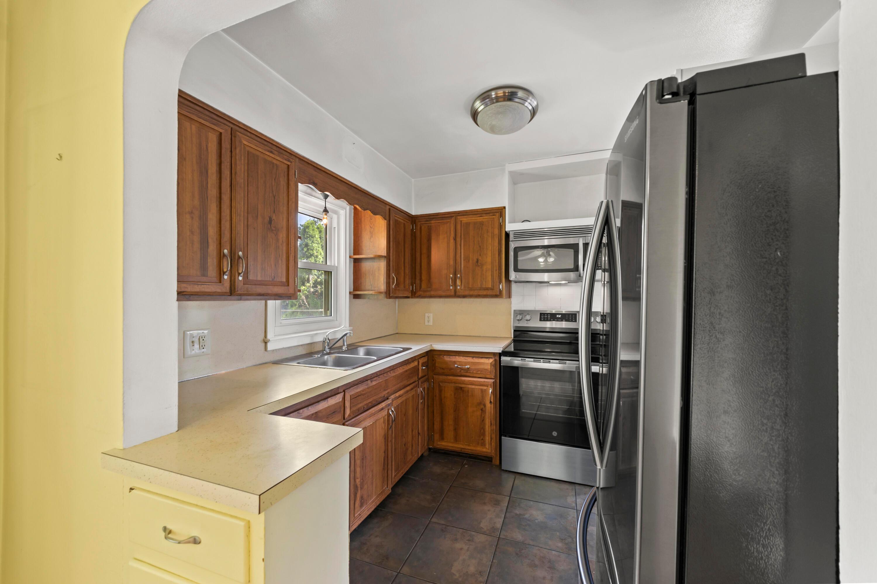 3260 Avalon Road Columbus, OH 43221 - Photo 18 of 46 kitchen featuring warm wood cabinetry, stainless steel appliances