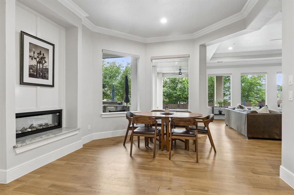 6700 Herbert Road Colleyville, TX 76034 - Photo 12 of 32 a view of a dining room with furniture window and wooden floor