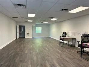 a view of a livingroom with furniture and a window
