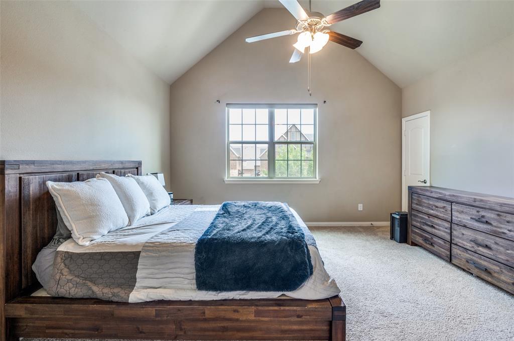 4665 Dozier Road, Unit C Carrollton, TX 75010 - Photo 12 of 26 a bedroom with a bed and window