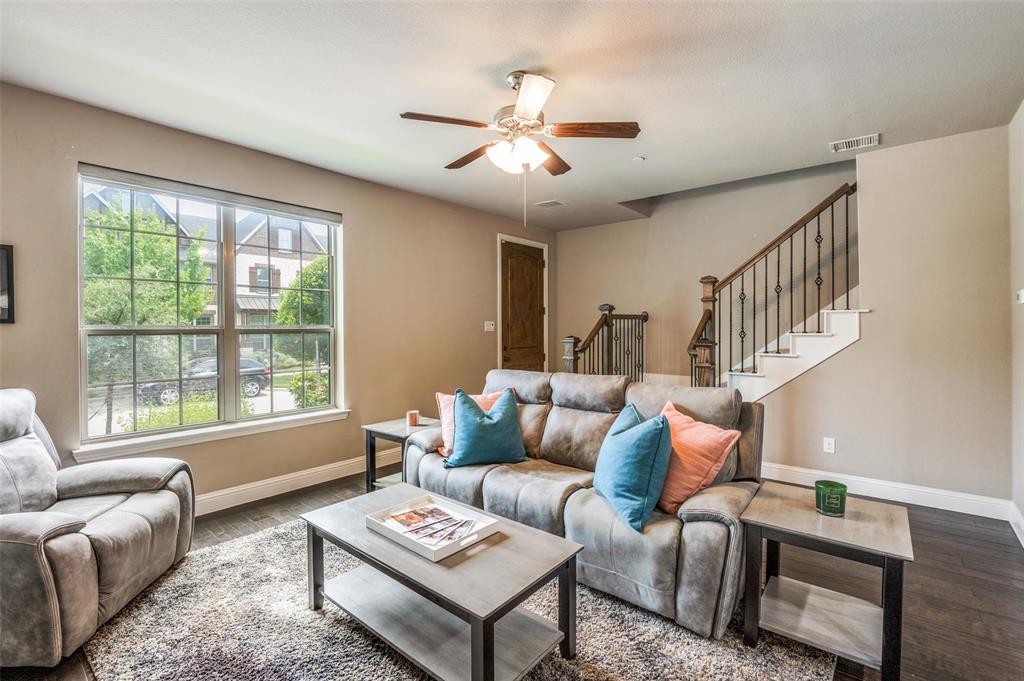 4665 Dozier Road, Unit C Carrollton, TX 75010 - Photo 2 of 26 a living room with furniture and a large window