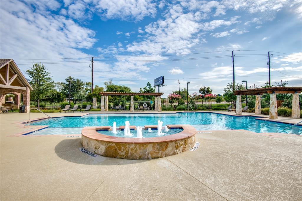 4665 Dozier Road, Unit C Carrollton, TX 75010 - Photo 22 of 26 a view of a swimming pool with a fountain