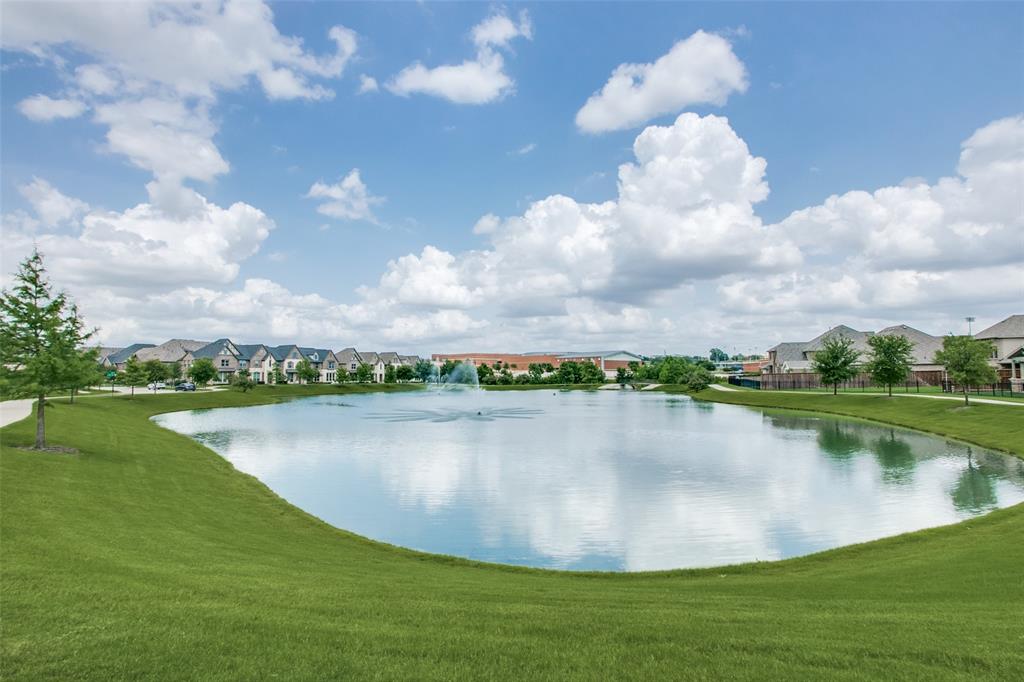 4665 Dozier Road, Unit C Carrollton, TX 75010 - Photo 23 of 26 a view of a lake with houses in the back