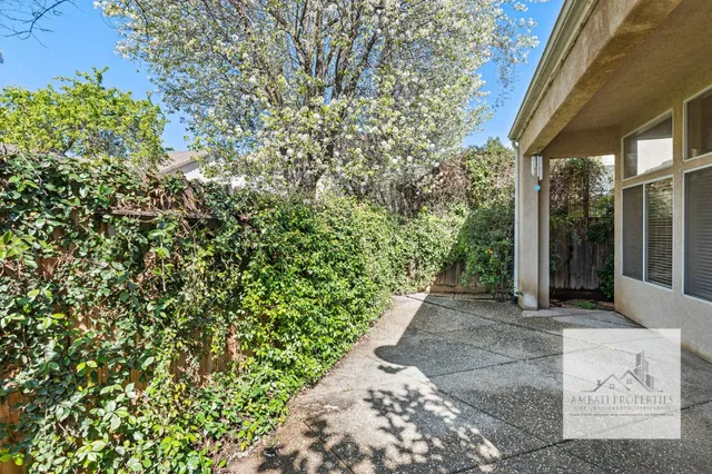 a view of a pathway both side of the house