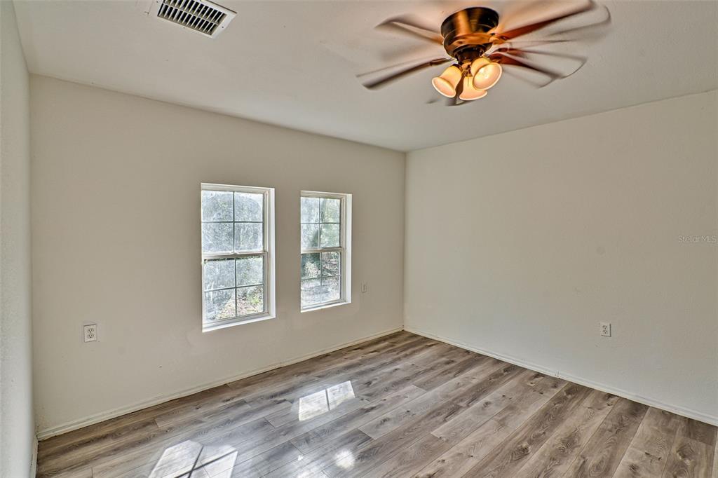 300 South Us Highway Bell, FL 32619 - Photo 15 of 47 wooden floor in an empty room with a window