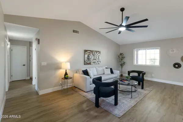 a living room with furniture and a window