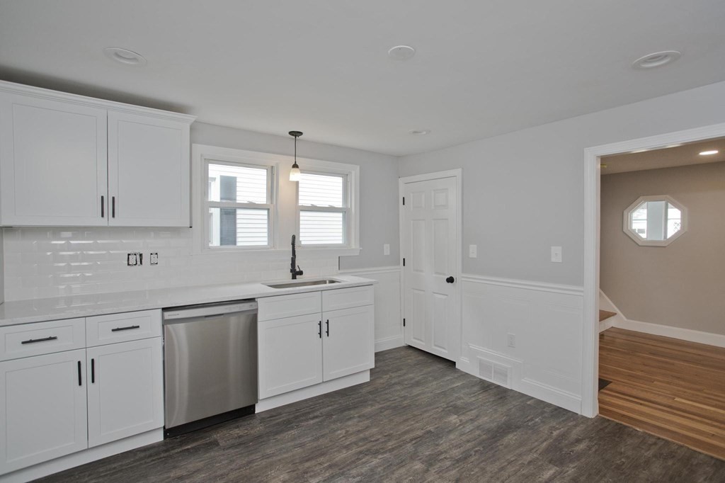 268 Shawmut Street Springfield, MA 01108 - Photo 3 of 42 a kitchen with white cabinets and sink