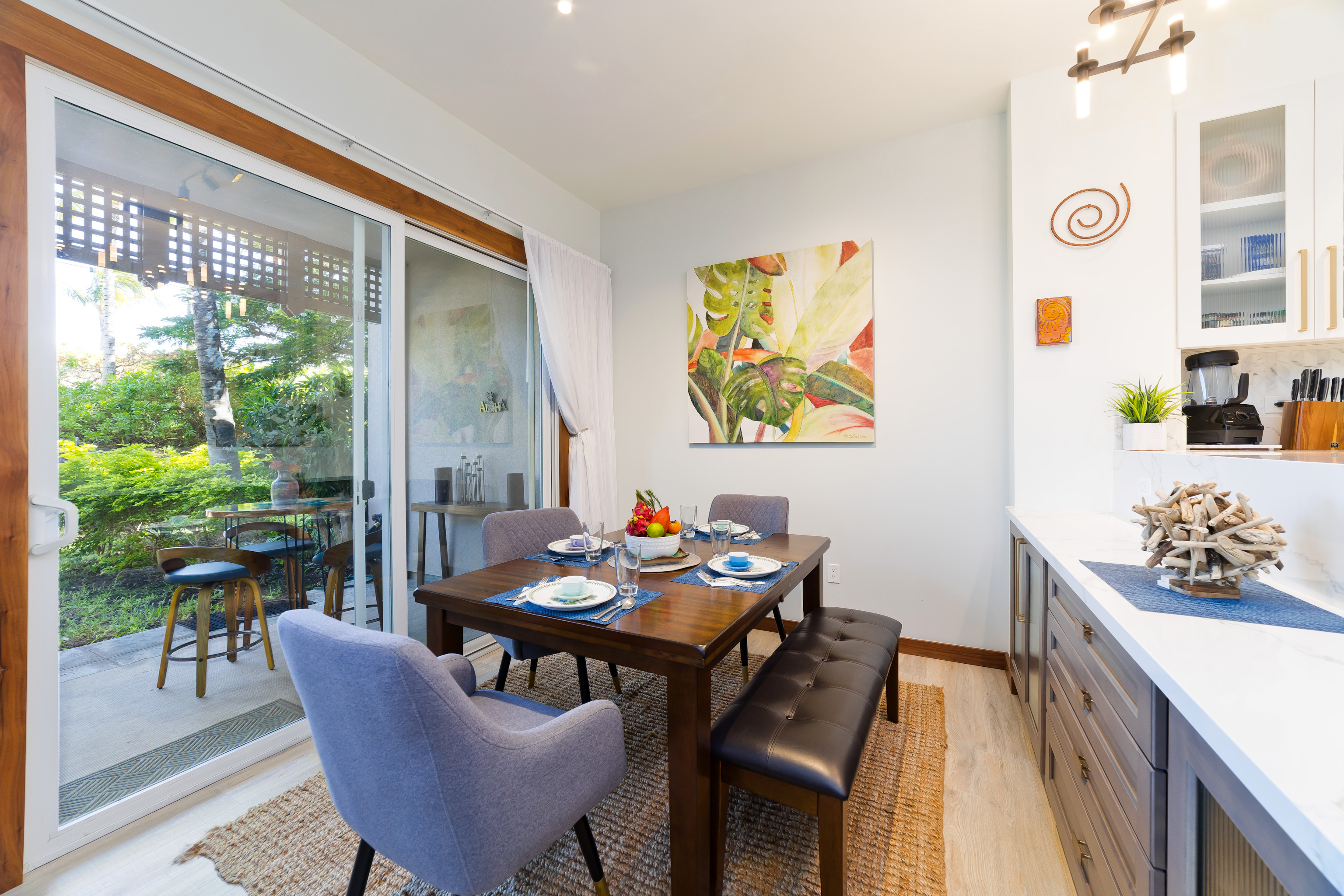 69-555 Waikoloa Beach Drive, Unit 2303 Waikoloa, HI 96738 - Photo 19 of 30 a view of a dining room with furniture one side kitchen view and wooden floor