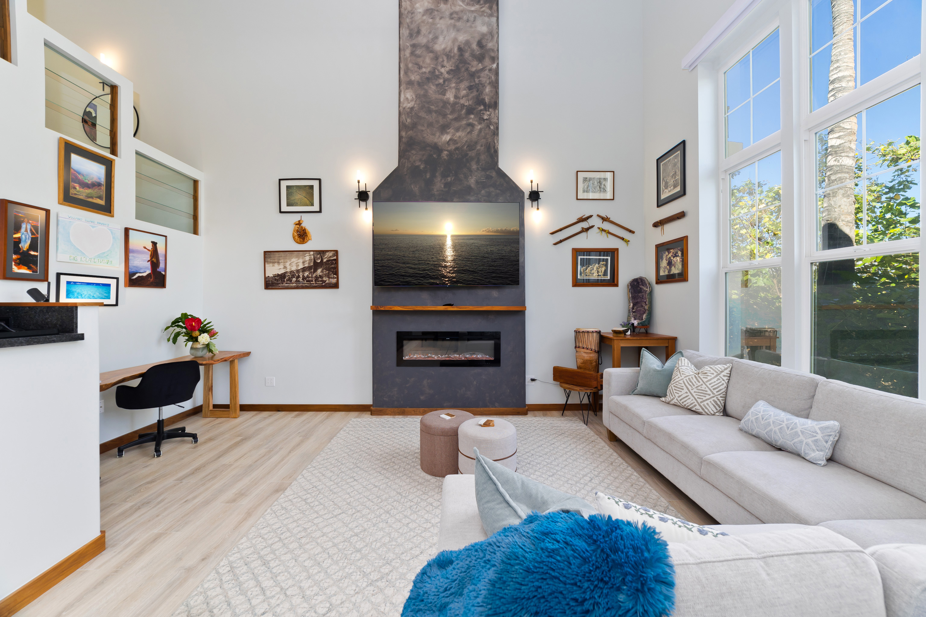 69-555 Waikoloa Beach Drive, Unit 2303 Waikoloa, HI 96738 - Photo 2 of 30 a living room with furniture and a flat screen tv