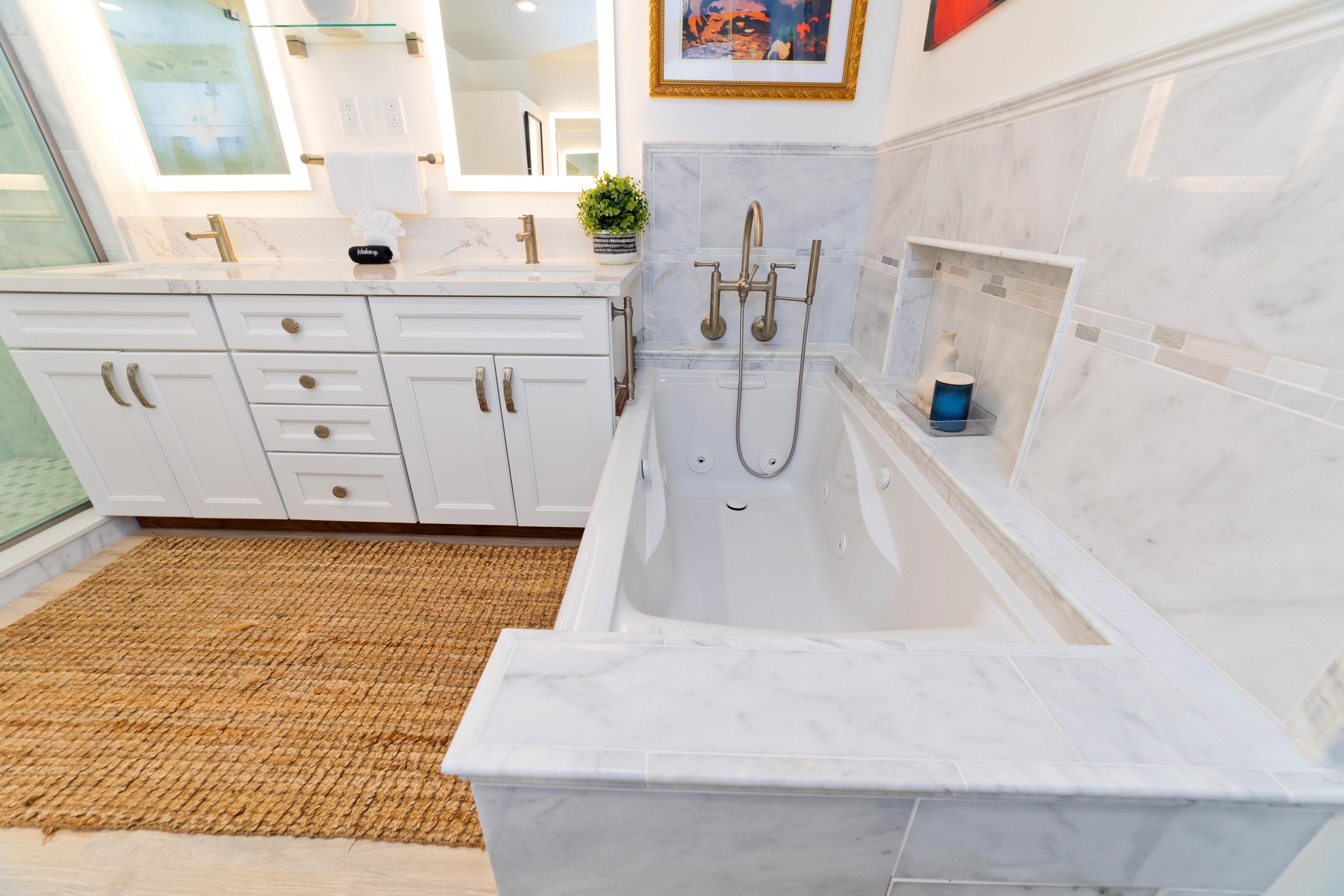 69-555 Waikoloa Beach Drive, Unit 2303 Waikoloa, HI 96738 - Photo 22 of 30 a bathroom with a bathtub sink and mirror