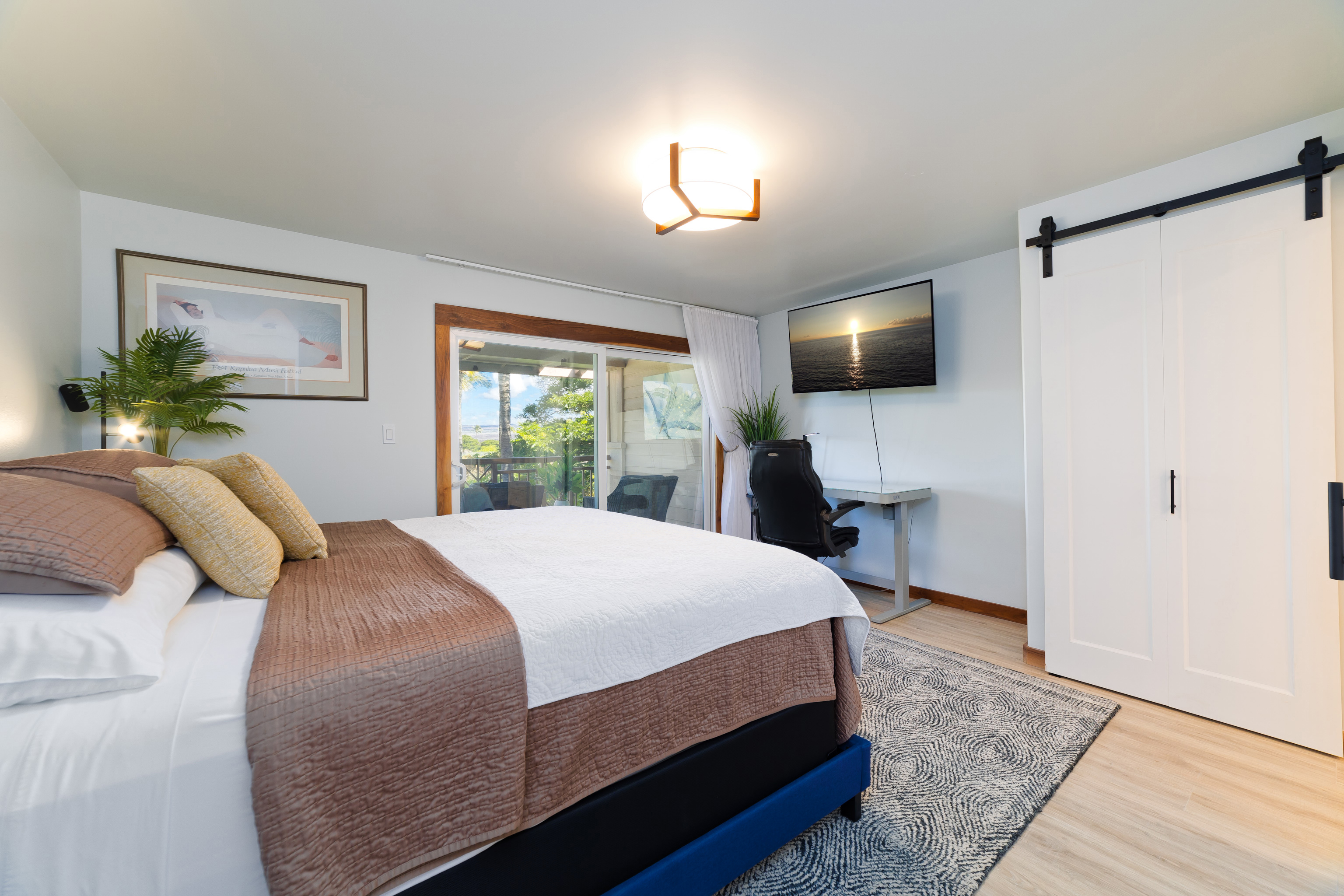 69-555 Waikoloa Beach Drive, Unit 2303 Waikoloa, HI 96738 - Photo 23 of 30 a bedroom with a bed and a flat screen tv