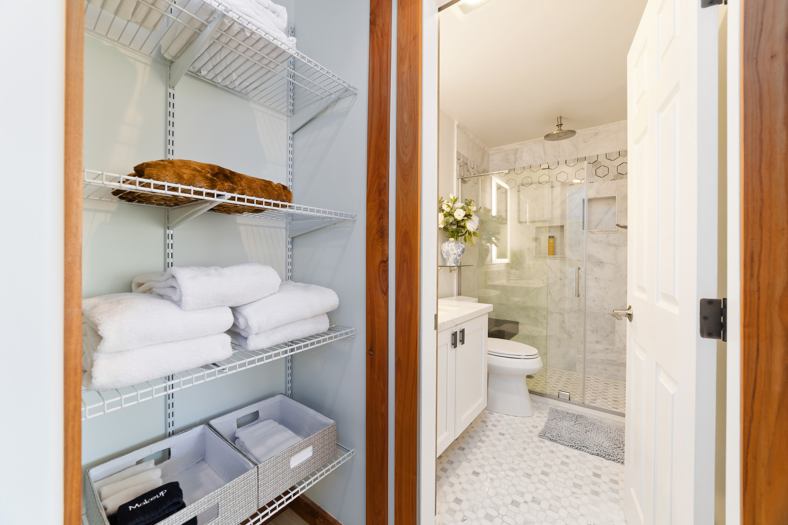 69-555 Waikoloa Beach Drive, Unit 2303 Waikoloa, HI 96738 - Photo 25 of 30 a bathroom with a sink a toilet and shower