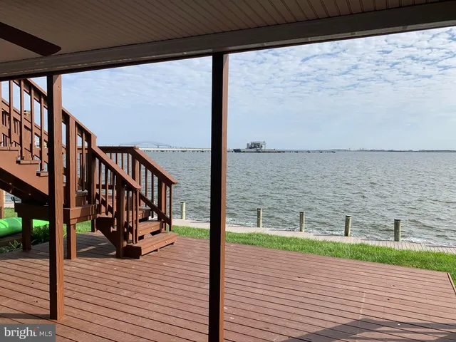 a view of a balcony with wooden floor
