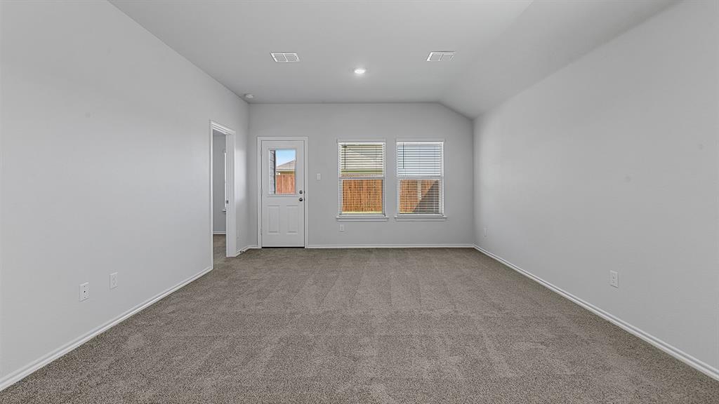 180 Mojave Road Boyd, TX 76023 - Photo 13 of 38 an empty room with a empty space and windows