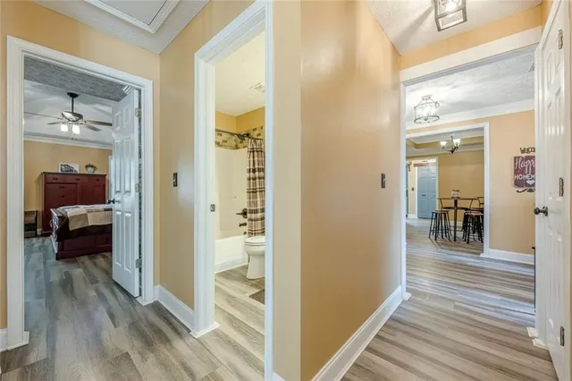 a bathroom with a double vanity sink toilet mirror and shower