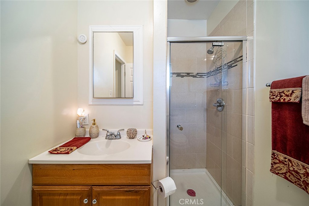 1016 Vina Avenue Long Beach, CA 90813 - Photo 16 of 22 a bathroom with a sink and a shower