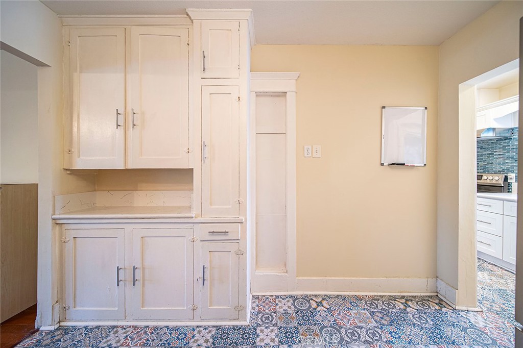 1016 Vina Avenue Long Beach, CA 90813 - Photo 10 of 22 a view of a kitchen with white cabinets