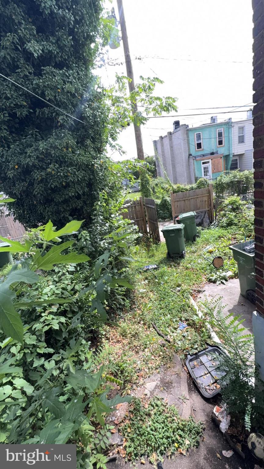 1723 Homestead Street Baltimore, MD 21218 - Photo 14 of 27 a backyard of a house with a yard and outdoor seating