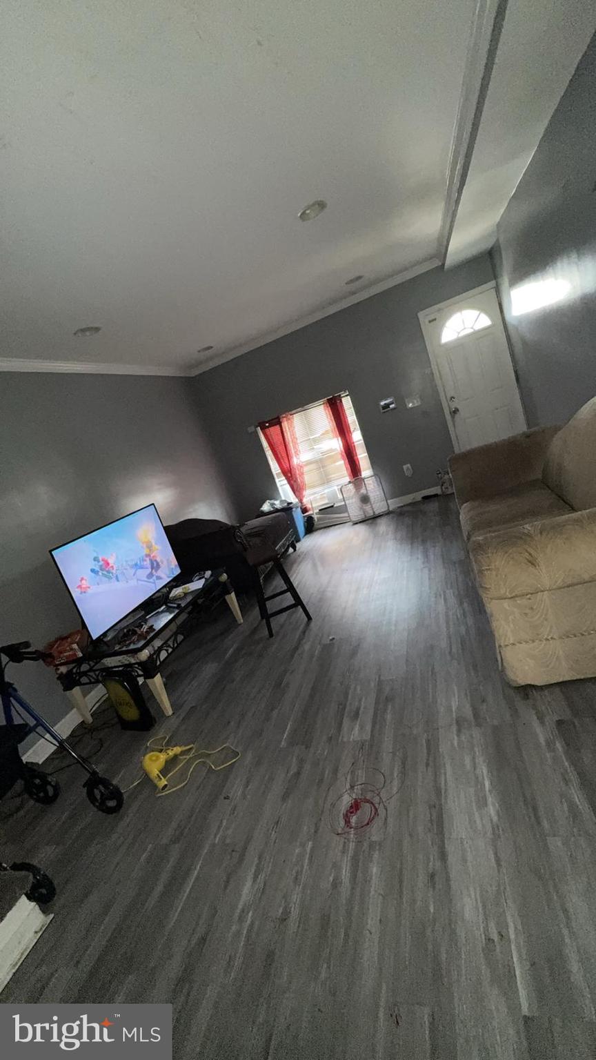 1723 Homestead Street Baltimore, MD 21218 - Photo 18 of 27 a living room with furniture and a wooden floor
