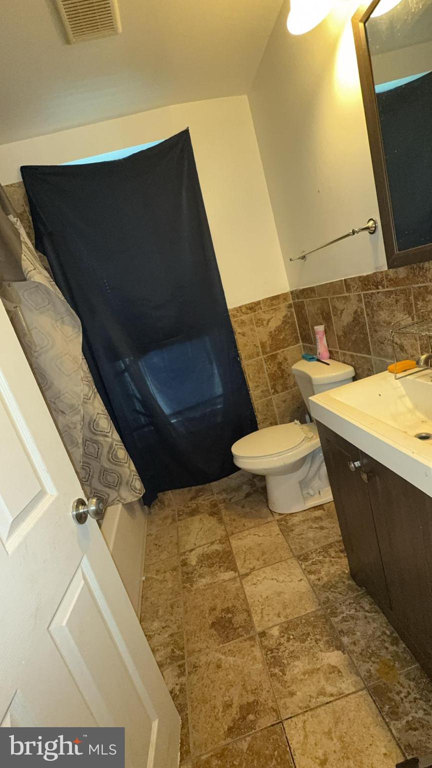 1723 Homestead Street Baltimore, MD 21218 - Photo 19 of 27 a bathroom with a sink and a toilet