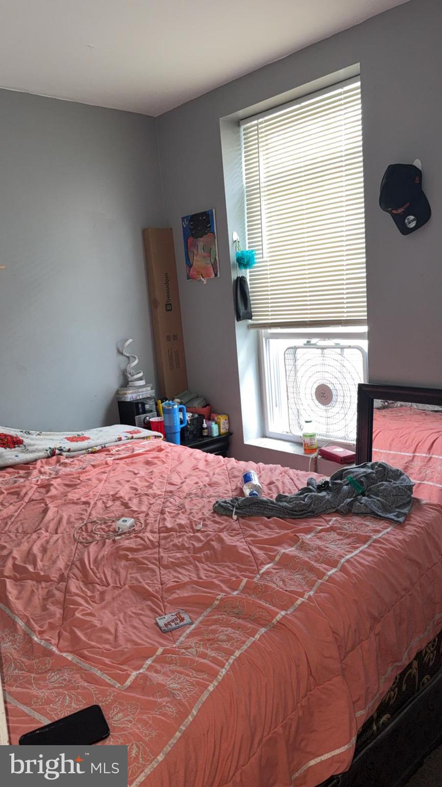 1723 Homestead Street Baltimore, MD 21218 - Photo 20 of 27 a bedroom with a bed and window