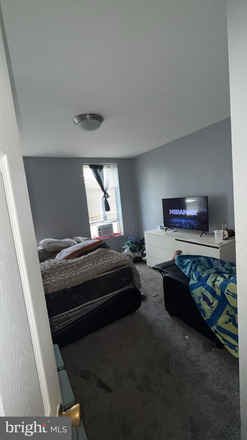 1723 Homestead Street Baltimore, MD 21218 - Photo 2 of 27 a bedroom with bed and a dresser