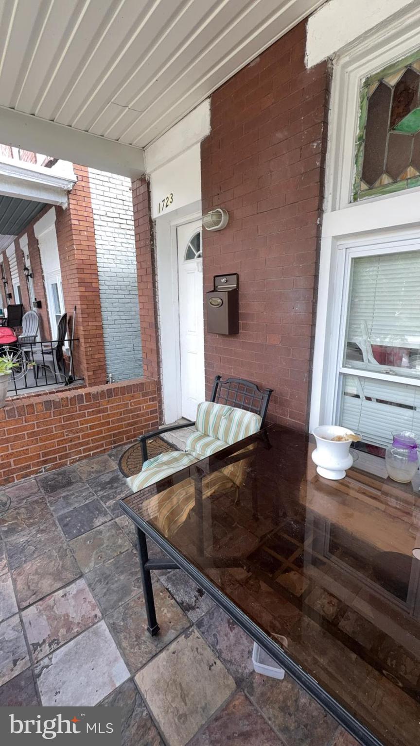1723 Homestead Street Baltimore, MD 21218 - Photo 24 of 27 a living room with couch and a fireplace