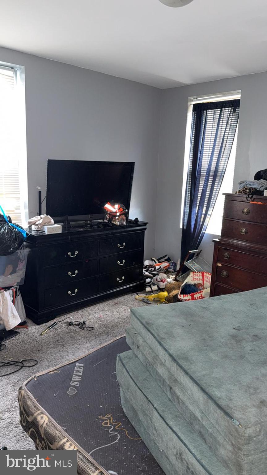 1723 Homestead Street Baltimore, MD 21218 - Photo 25 of 27 a living room with furniture and a flat screen tv