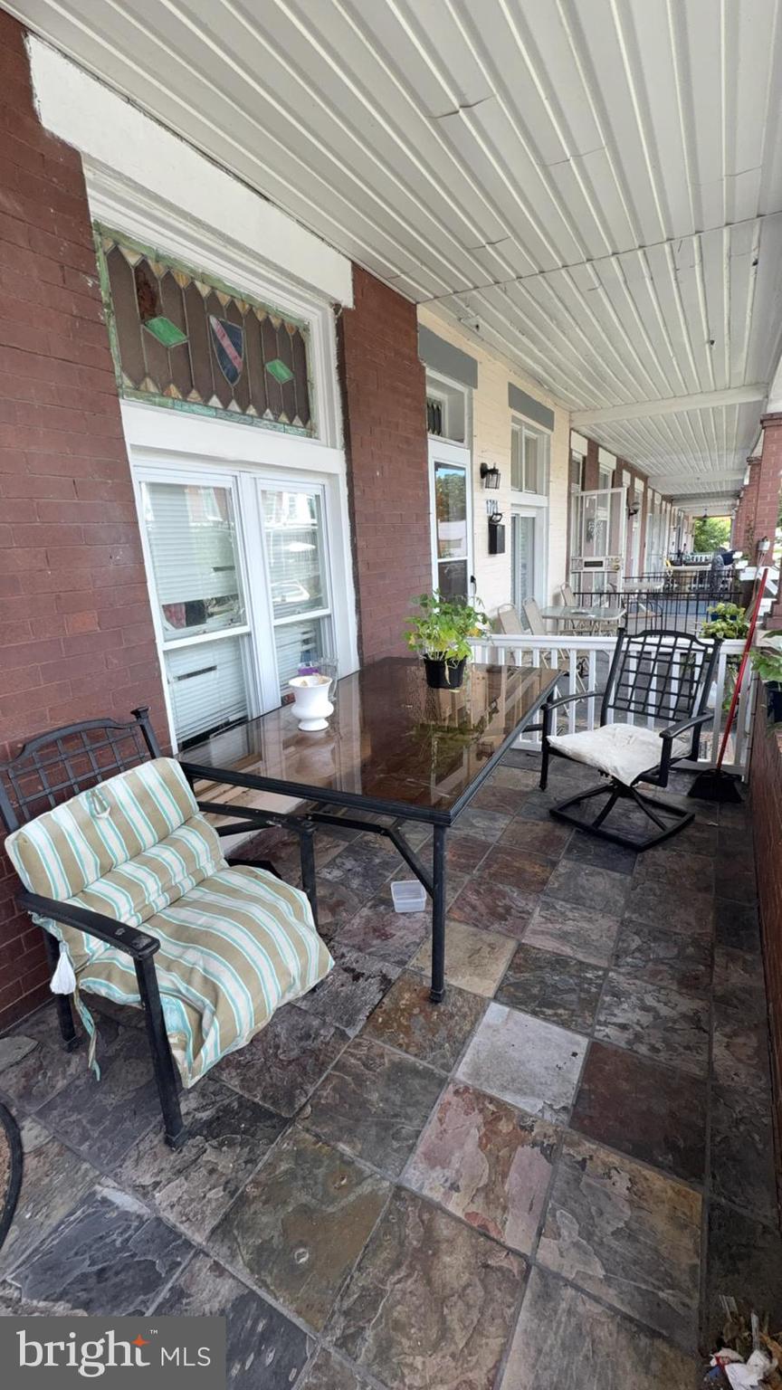 1723 Homestead Street Baltimore, MD 21218 - Photo 27 of 27 a backyard of a house with outdoor seating