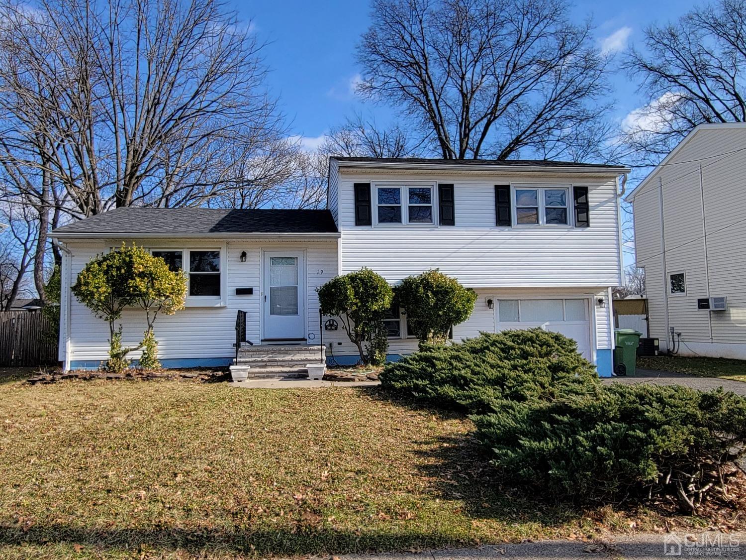 19 Baldwin Road Edison, NJ 08817 - Photo 1 of 36 a front view of a house with garden