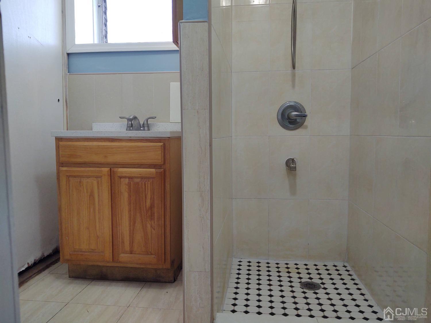19 Baldwin Road Edison, NJ 08817 - Photo 14 of 36 a bathroom with a sink and a shower