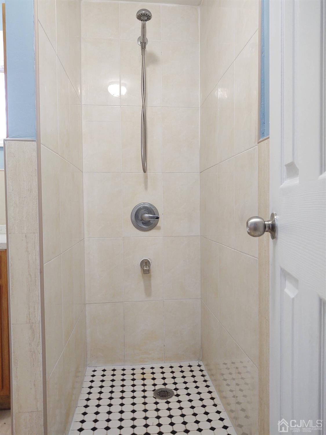 19 Baldwin Road Edison, NJ 08817 - Photo 15 of 36 a bathroom with a shower