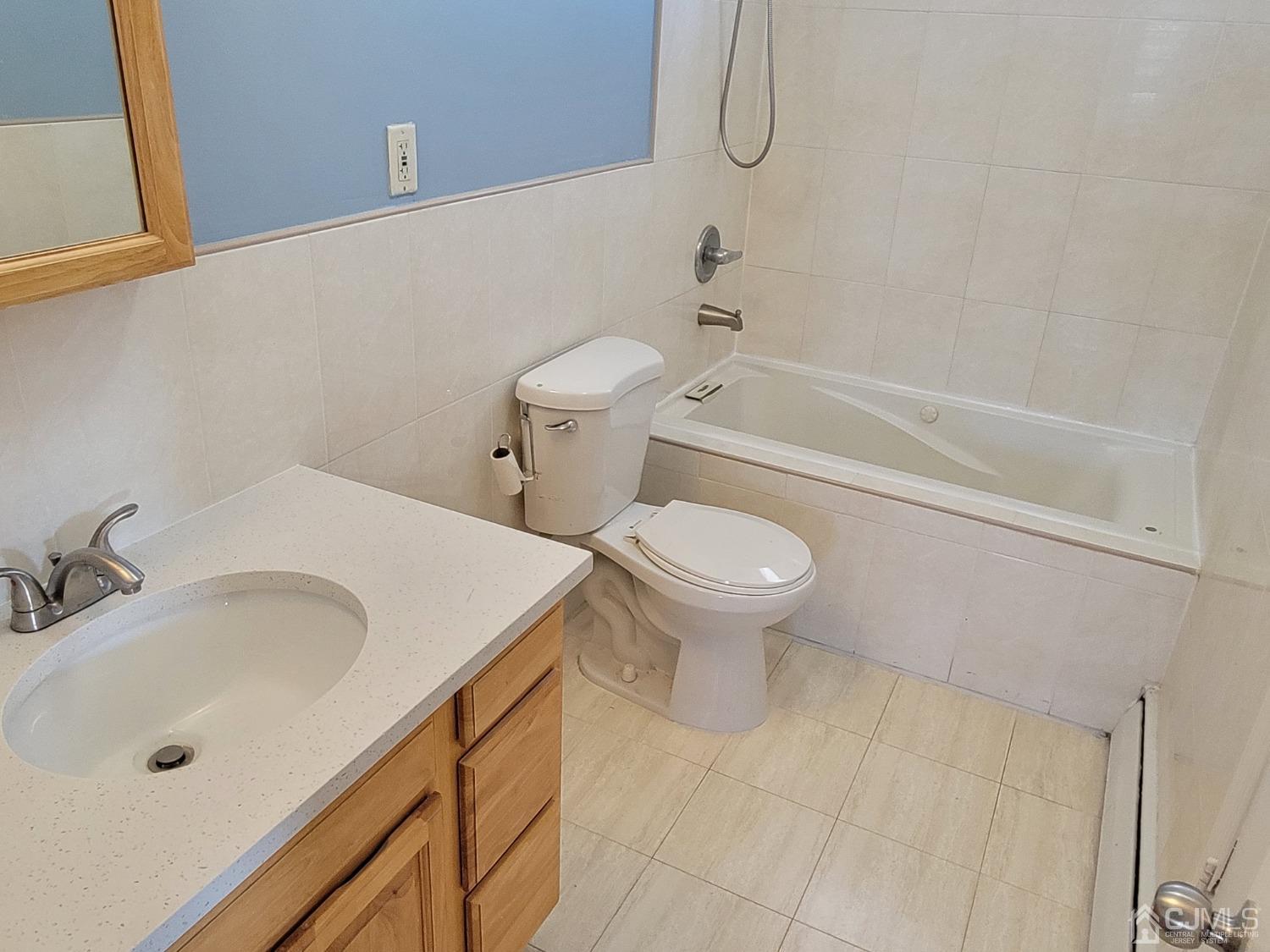 19 Baldwin Road Edison, NJ 08817 - Photo 20 of 36 a bathroom with a sink a toilet and bathtub