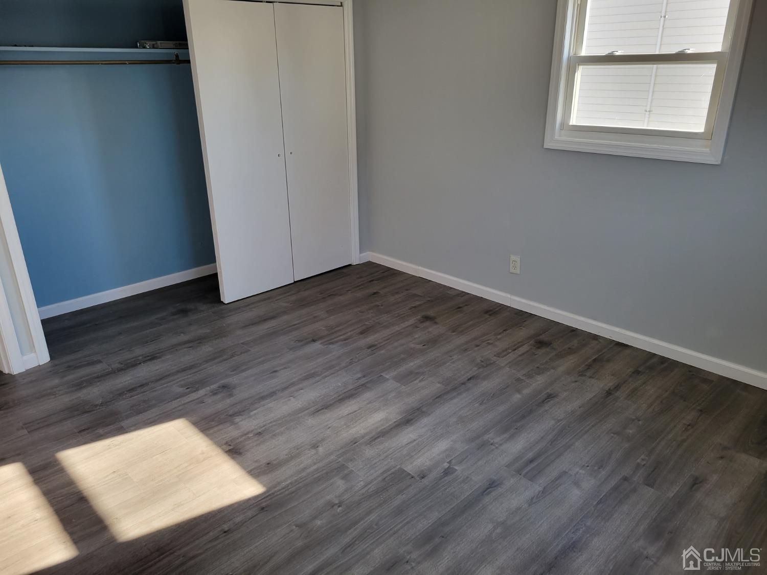 19 Baldwin Road Edison, NJ 08817 - Photo 26 of 36 a view of wooden floor and windows in an empty room