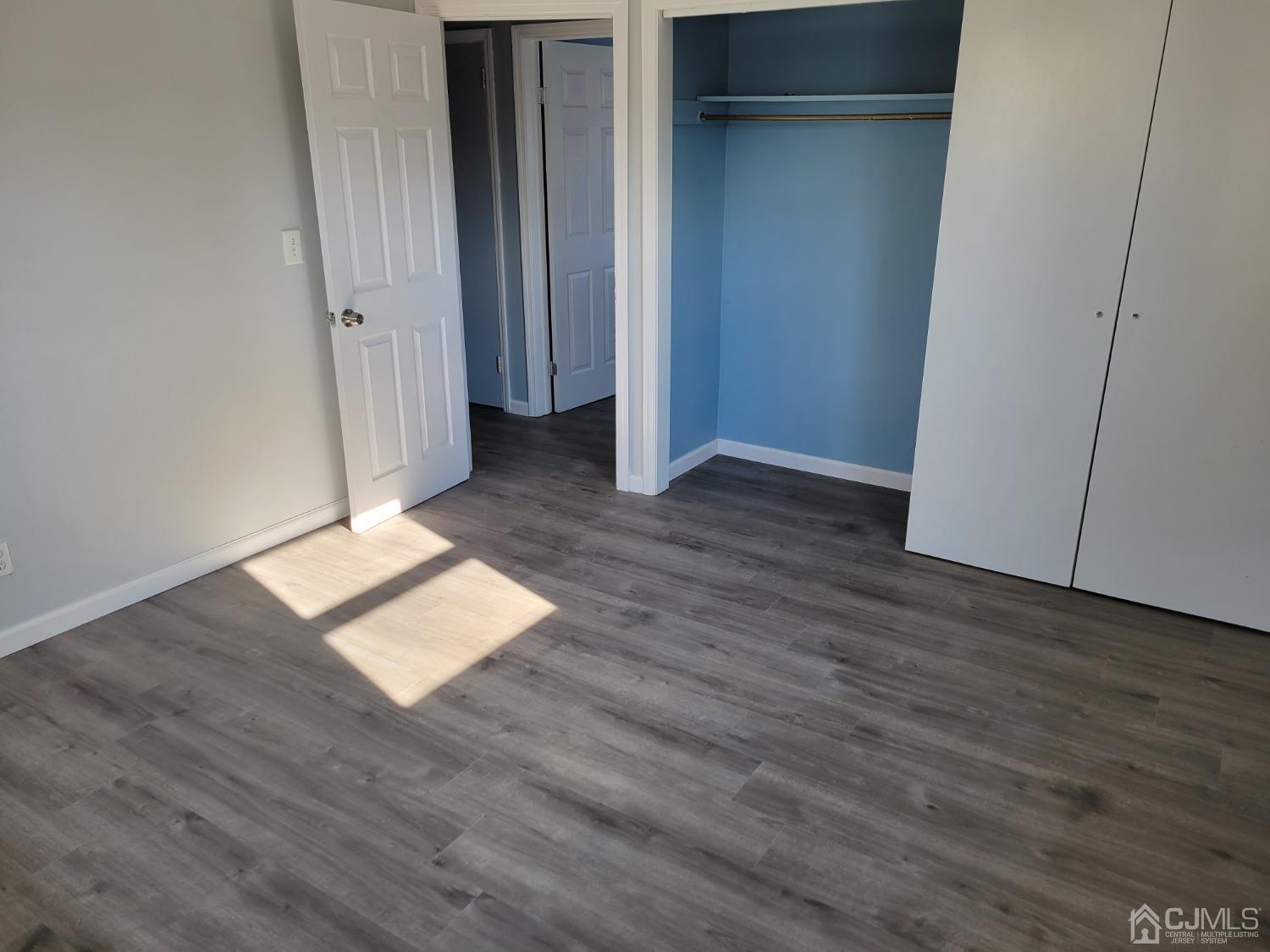 19 Baldwin Road Edison, NJ 08817 - Photo 27 of 36 a view of wooden floor and windows in a room