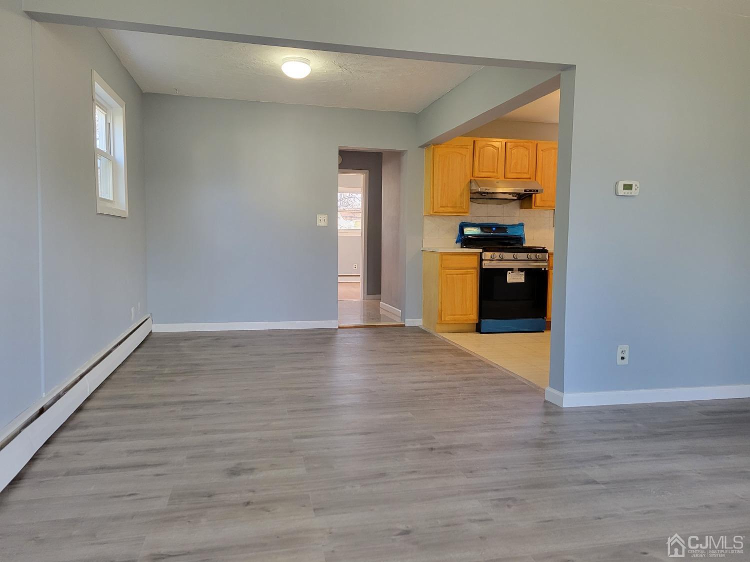 19 Baldwin Road Edison, NJ 08817 - Photo 3 of 36 a view of a kitchen with a stove cabinets and wooden floor