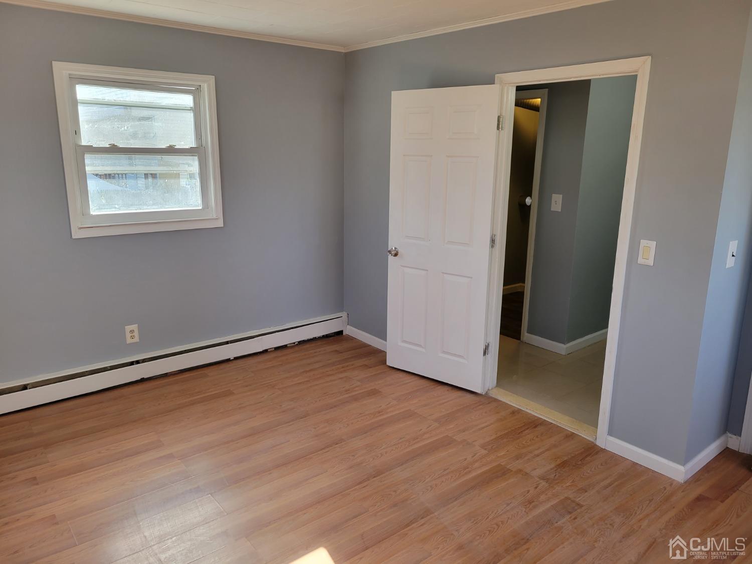 19 Baldwin Road Edison, NJ 08817 - Photo 8 of 36 an empty room with wooden floor and closet