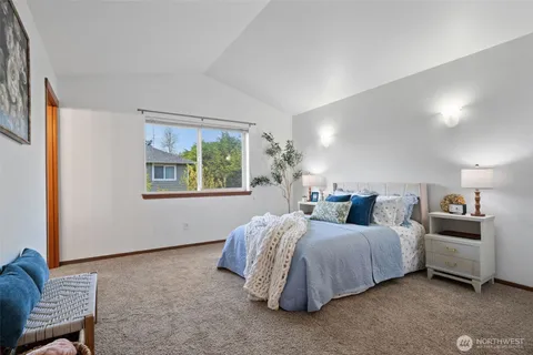 a bedroom with bed and window