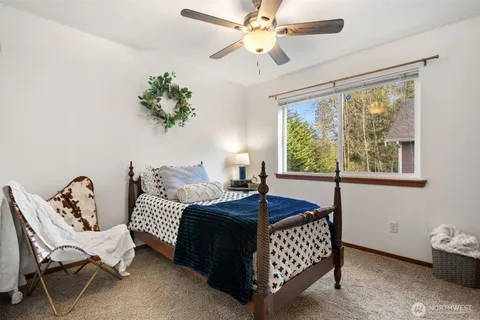 a bedroom with furniture and a window