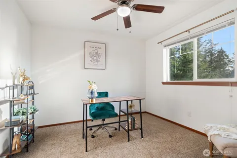 a workspace with furniture and a window
