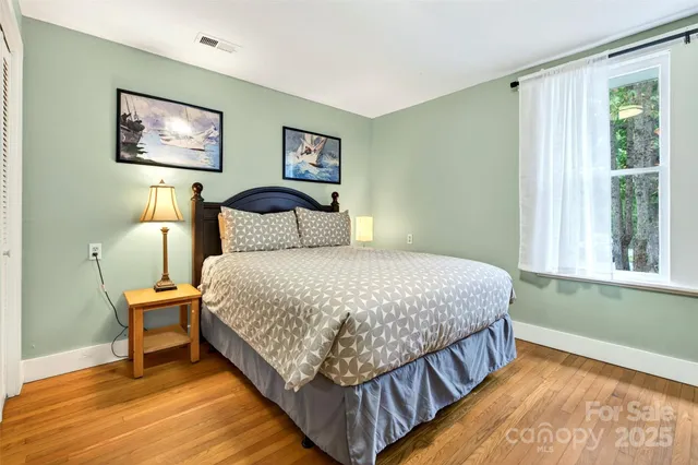 a bedroom with bed and a window