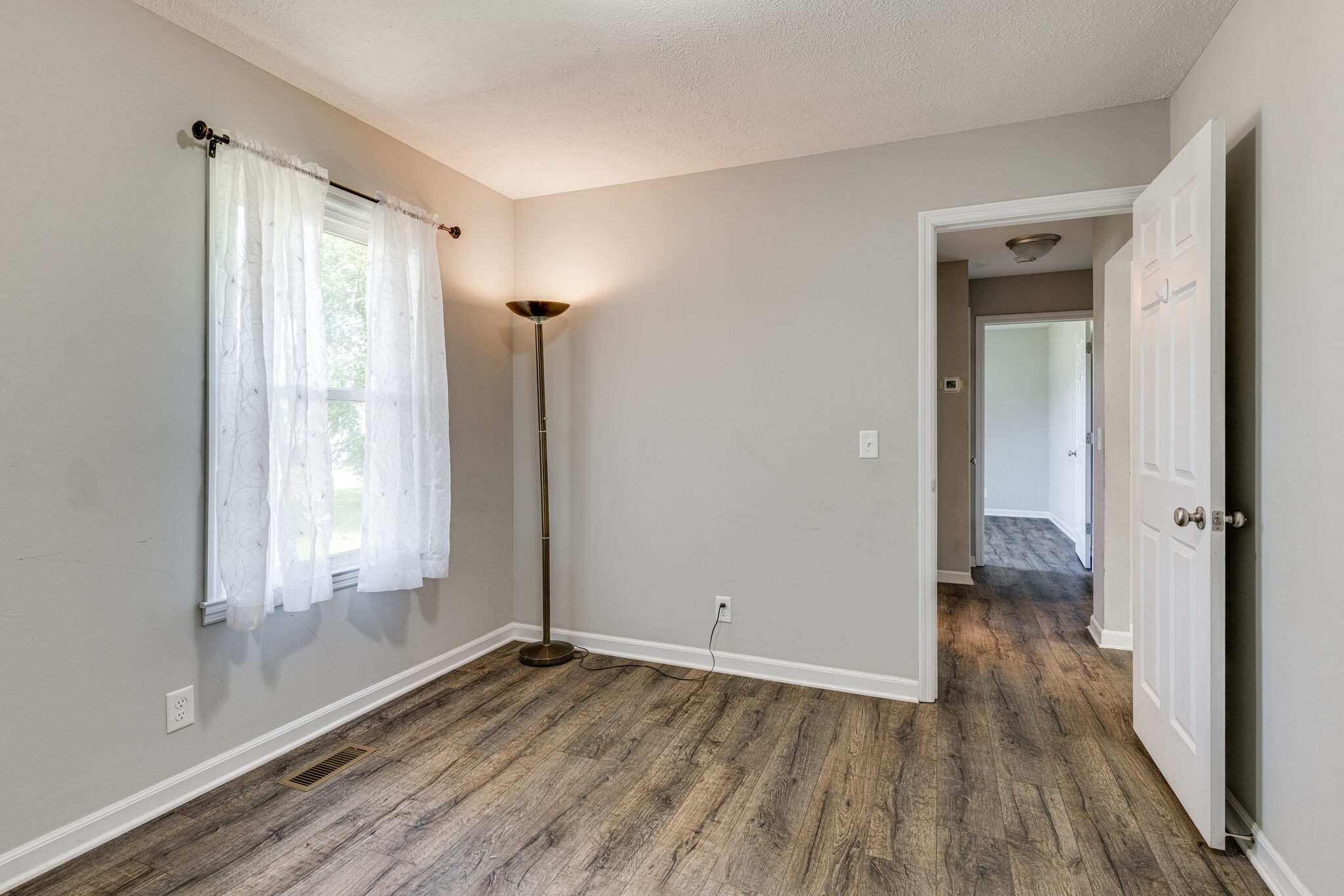 4752 Lahr Road Springfield, TN 37172 - Photo 13 of 27 a view of empty room with wooden floor and fan