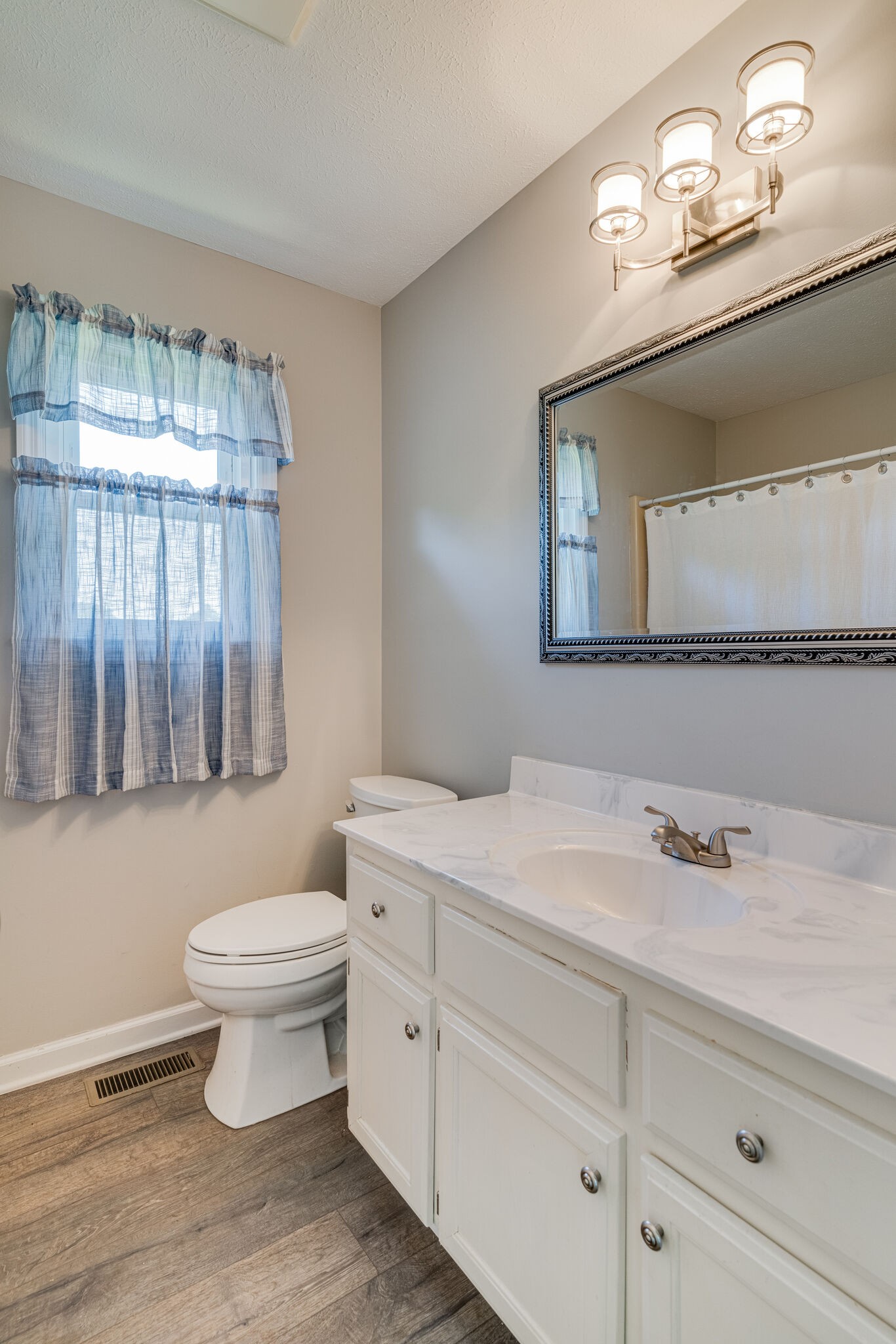 4752 Lahr Road Springfield, TN 37172 - Photo 14 of 27 a bathroom with a sink a toilet and mirror