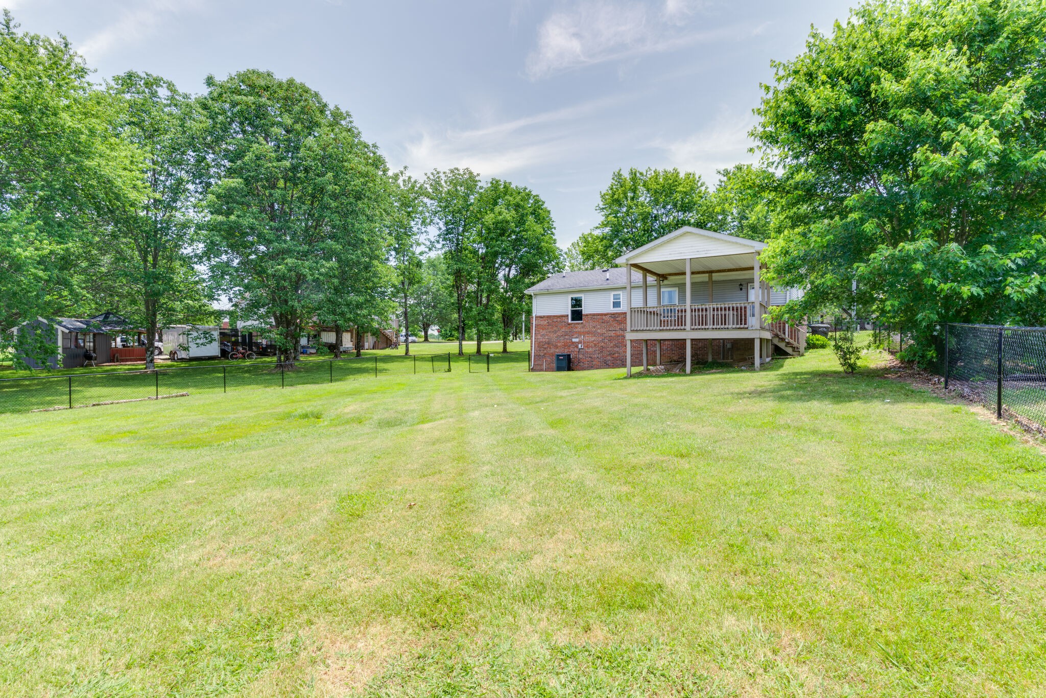 4752 Lahr Road Springfield, TN 37172 - Photo 24 of 27 a view of a house with a big yard and large trees