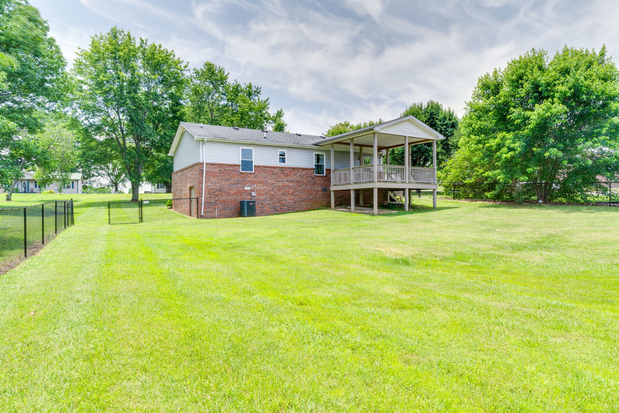 4752 Lahr Road Springfield, TN 37172 - Photo 25 of 27 a view of a house with a big yard and large trees