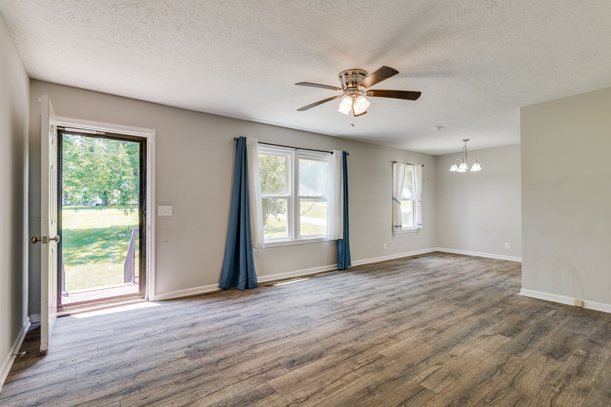4752 Lahr Road Springfield, TN 37172 - Photo 4 of 27 a view of an empty room with a window and wooden floor