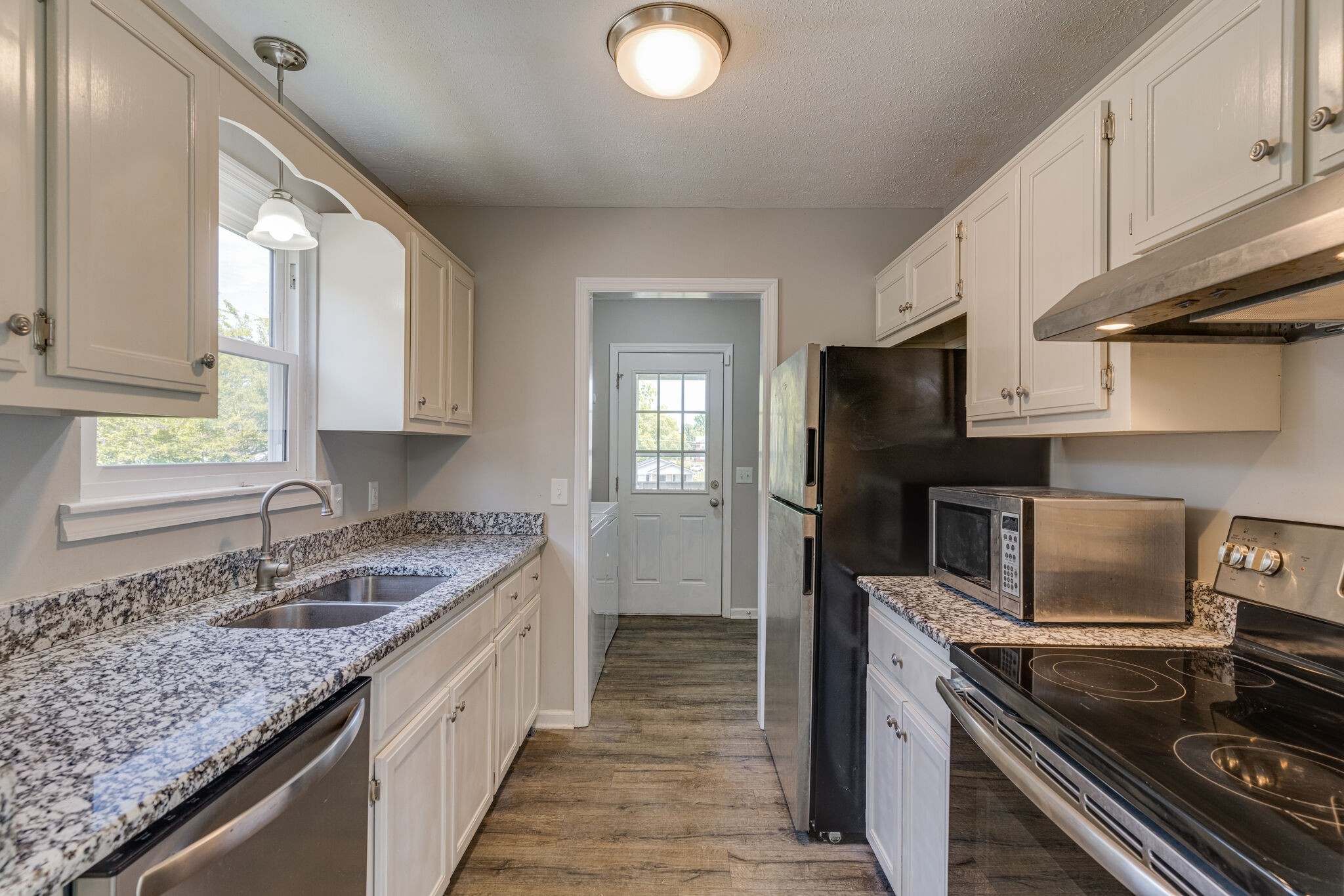 4752 Lahr Road Springfield, TN 37172 - Photo 7 of 27 a kitchen with a sink stove and cabinets